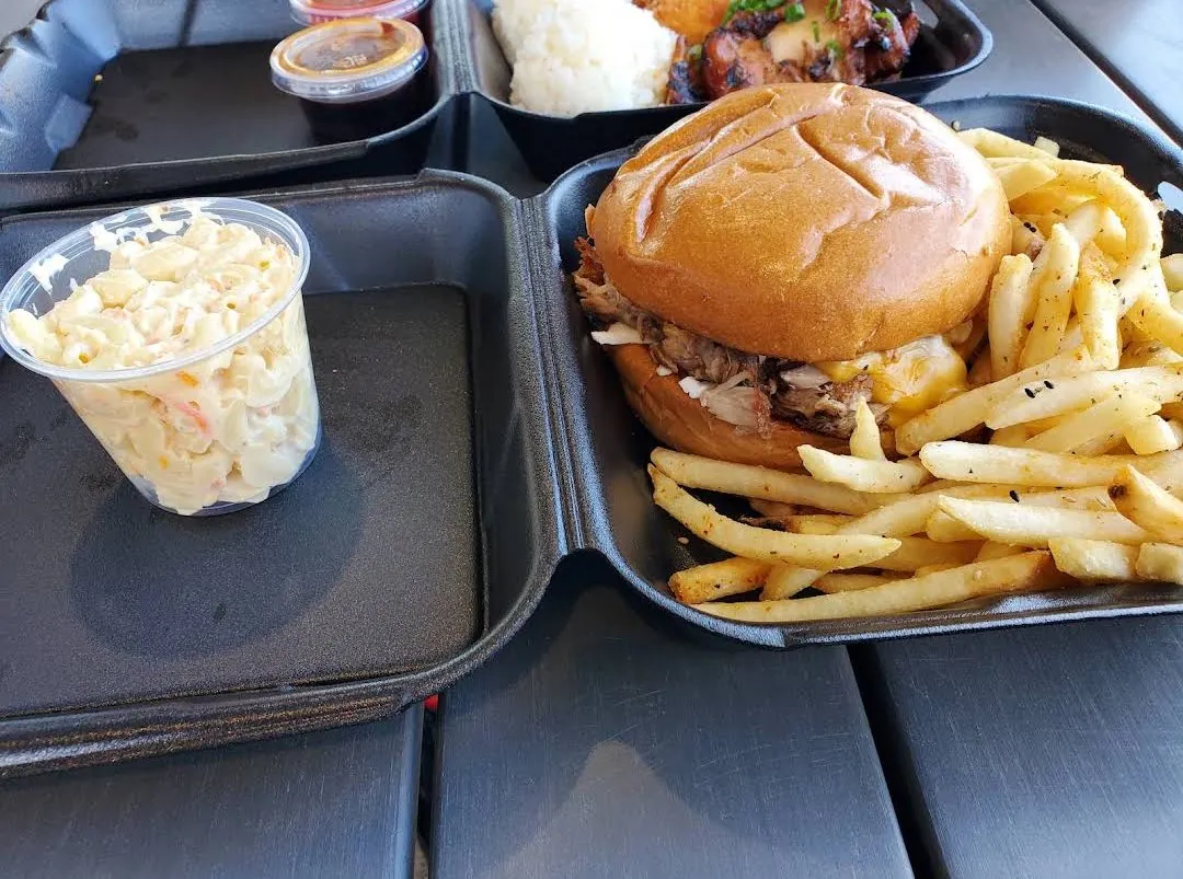 Pulled pork sandwich with fries and mac salad at 9th Island Grill