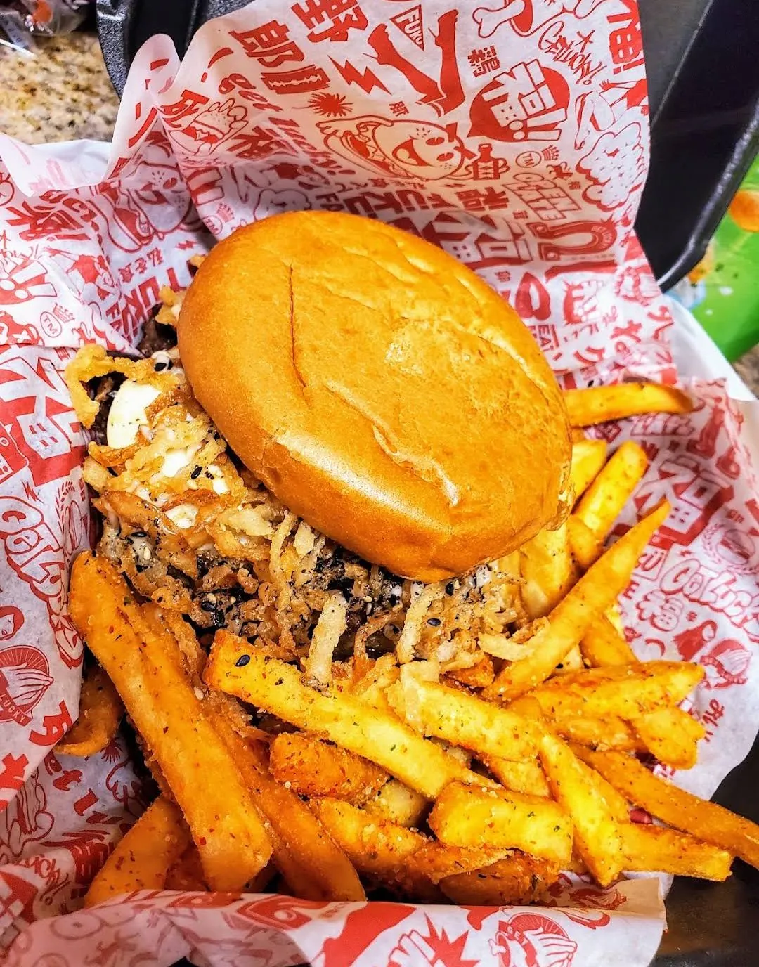 TAMAGO burger with crispy onion strings and seasoned fries at Fuku Burger