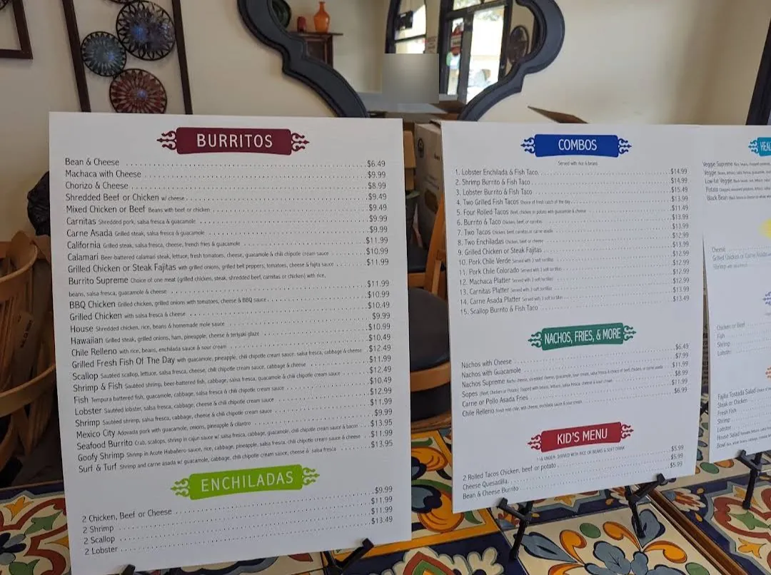 Burritos and enchiladas menu boards at Mi Ranchito