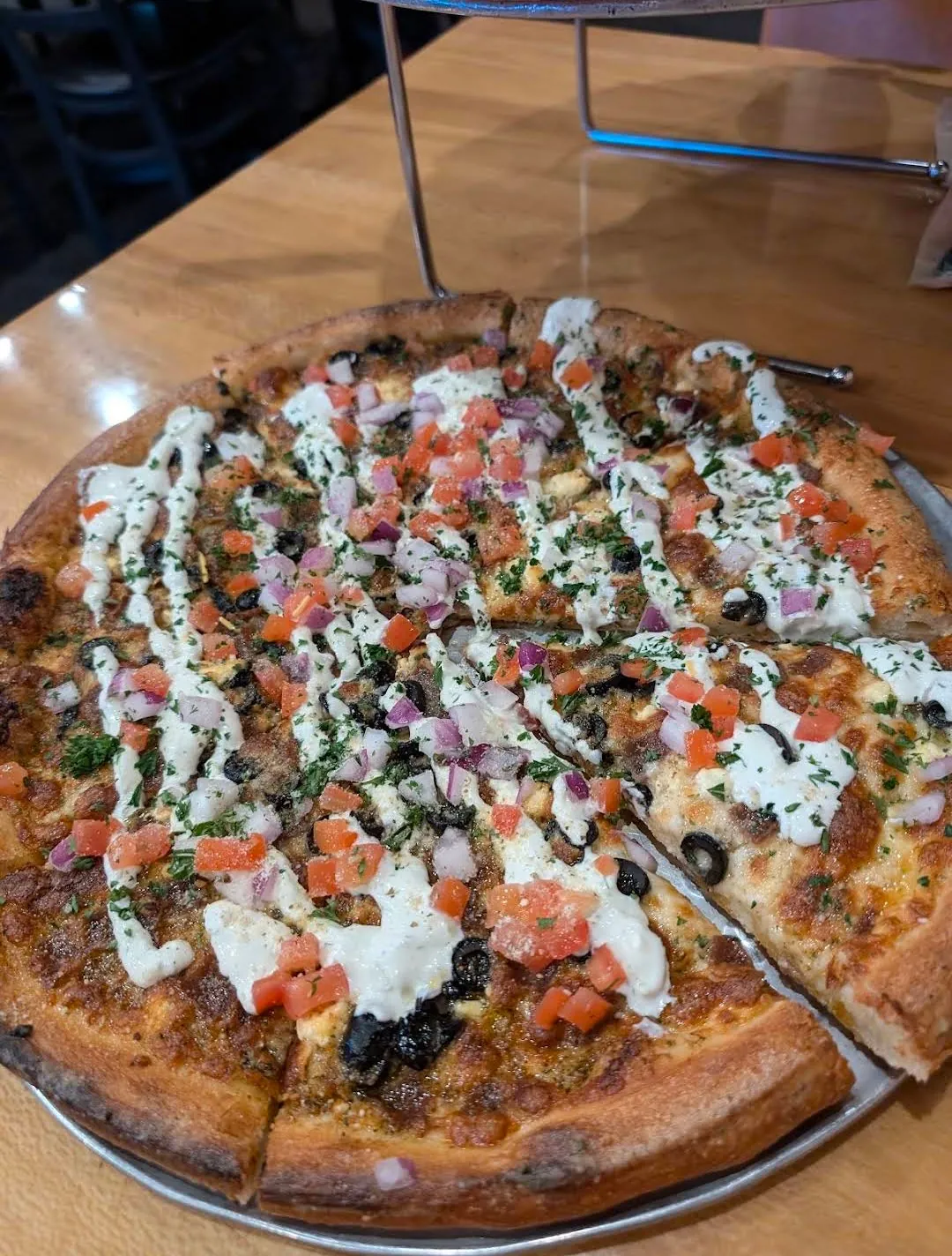 Gyro Pizza with tzatziki, tomatoes, red onions and black olives at Uncle Joe's Pizzeria